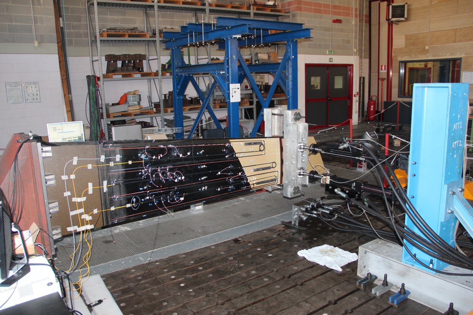 Portion of an Unmanned Aerial Vehicle (UAV) stabilizer instrumented by POLIMI, subjected to bending loads, and monitored using the inverse Finite Element Method (iFEM).